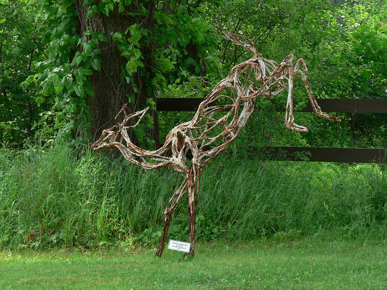 June 25, 2006 - Mill Brook Gallery, Concord, New Hampshire.<br />Wendy Klemperer, "White Leaping Deer", steel and paint, $3000.