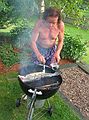 July 4, 2006 - At Uncle Tom's cabin, South Hampton, New Hampshire.<br />Paul fine tuning the salmon.