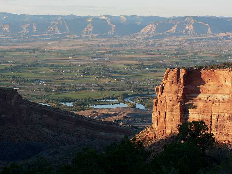 August 10, 2006 - Colorado National Monument near Grand Junction, Colorado.<br />View along Rim Rock Drive.<br />The Colorado River and Book Range beyond.