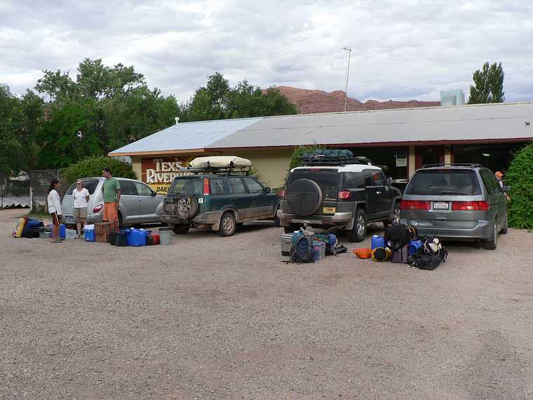 August 12, 2006 - Moab, Utah.<br />Our cars and gear at Tex's River Ways, the guys who rented us canoes<br />and provided transportation to the Green River and from the Colorado.