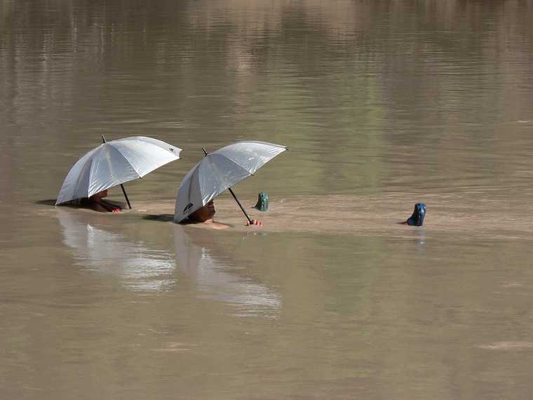 August 14, 2006 - Day 3 on the Green River, Utah.<br />Sati and Melody drifting by while enjoying some shade.