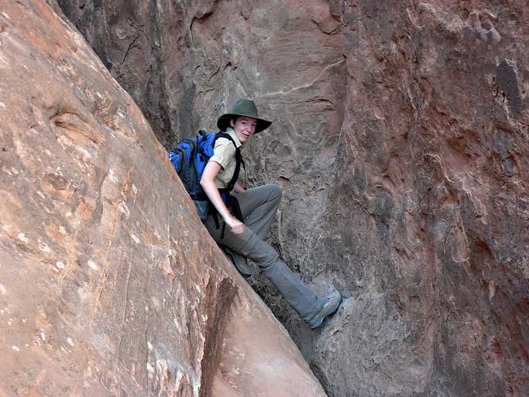 August 18, 2006 - Arches National Park, Utah.<br />A guided tour through Fiery Furnace, the coolest place in the park.<br />Our guide demonstrating how to get through a tight place.