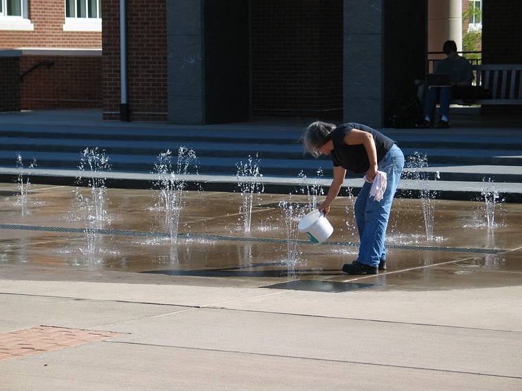 Sept. 20, 2006 - Longwood University, Farmville, Virginia.<br />Installation and priming of Joyce's "Strobus".<br />Joyce getting water from fountain on Brock Commons.