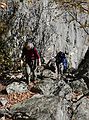 October 8, 2006 - Mt. Percival and Mt. Morgan hike near Holderness, New Hampshire.<br />Joyce, followed by Deb, after crawling through the cave along trail to Mt. Percival.