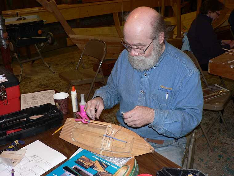 April 11, 2007 - Amesbury, Massachusetts.<br />Model boat building class at Lowell's Boat Shop.<br />Our instructor Paul is building the windshield on the class model.