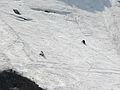 May 24, 2007 - Tuckerman Ravine Trail, Pinkham Notch, New Hampshire.<br />A snowboarder and a skier climbing for another run.