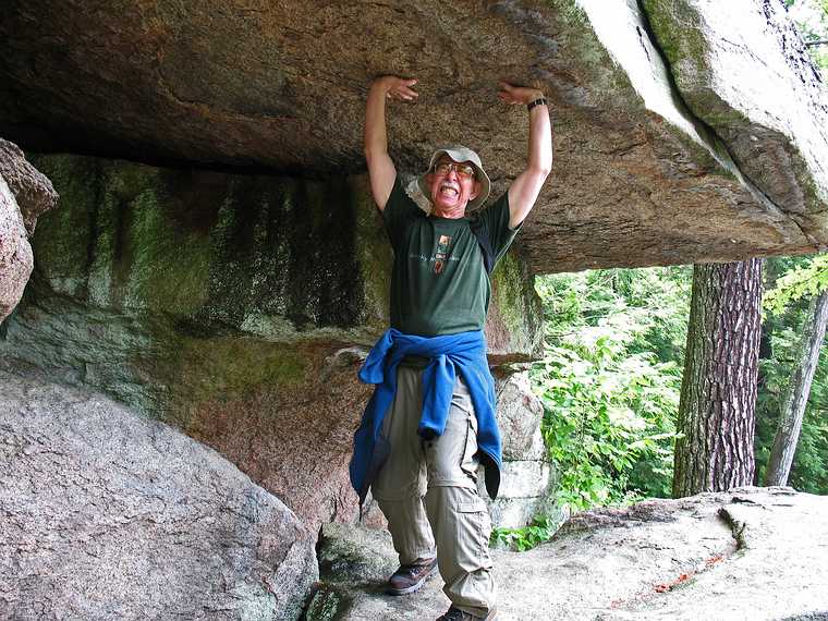 July 10, 2007 - Pawtuckaway State Park, Nottingham, New Hampshire.<br />Ronnie holding up a boulder along Boulder Trail to make sure it wouldn't fall on us.