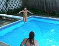 July 22, 2007 - Lawrence, Massachusetts.<br />At Marie's pool to celebrate Holly's birthday.<br />Miranda's first jump from the diving board with Carl to catch her (she doesn't swim yet).