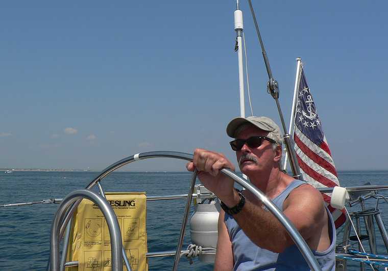 July 26, 2007 - On the Atlantic off the coast of Massachusetts/New Hampshire.<br />A few hours of sailing with Nancy and John.<br />John at the helm.