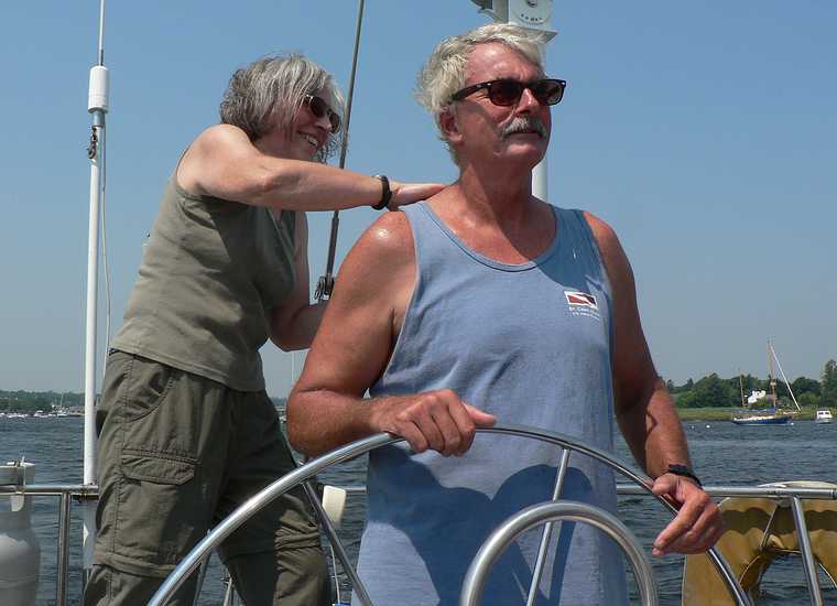 August 3, 2007 - Newburyport/Salisbury, Massachusetts.<br />Sailing on John and Nancy's boat.<br />Joyce, standing of a seat, applying sun tan lotion to John.