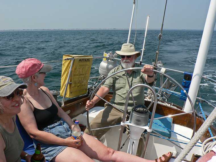 August 3, 2007 - On the Atlantic off the coast of Massachusetts.<br />Sailing on John and Nancy's boat.<br />Joyce, Deb, and Egils wrestling with the helm.