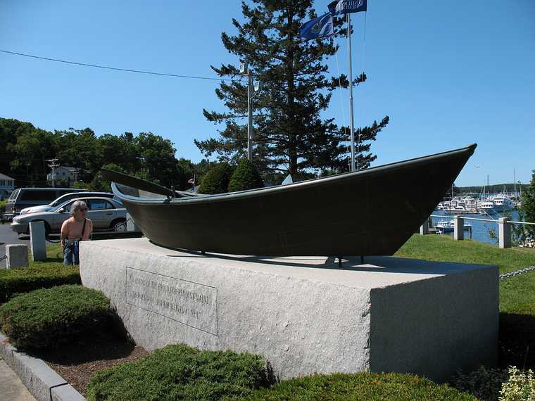August 5, 2007 - Boothbay Harbor, Maine.<br />Joyce and dory. The inscription says: "In honor of the proud, independent Maine<br />fishermen who lost their lives at sea".