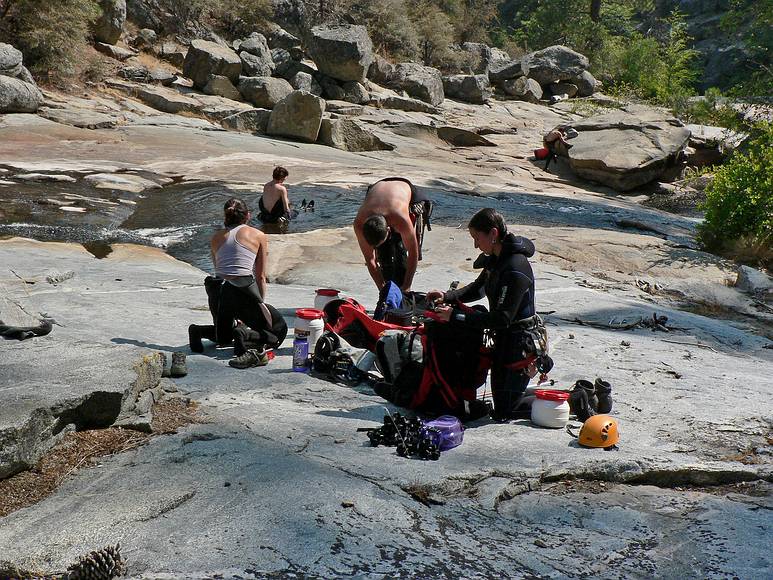 August 15, 2007 - Sequoia National Forest, California.<br />At the canyoneering trip start on Ten Mile Creek.<br />Stacy, Sati, and Melody packing and Heather cooling off in the water.