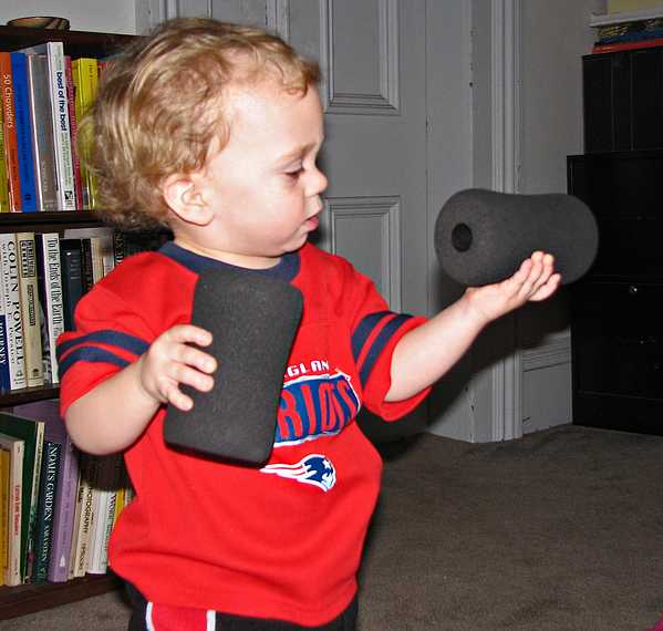 Nov. 22, 2007 - Thanksgiving dinner at Paul and Norma's, Tewksbury, Massachusetts.<br />Matthew admiring Paul's exercise equipment accessories.