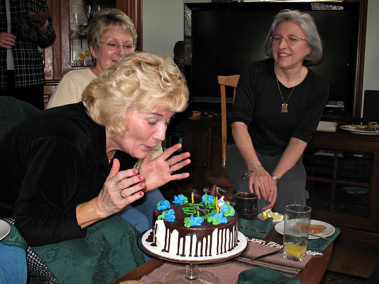 April 13, 2008 - Merrimac, Massachusetts.<br />Joyce's High School class get together.<br />Carol, Eileen blowing out the candles (as the oldest of the group), and Joyce.