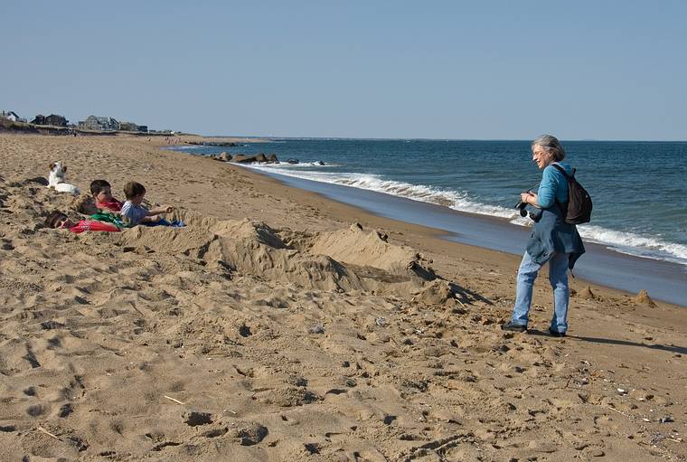 April 24, 2008 - North end of Plum Island, Massachusetts.<br />Joyce photographing boys who build a structure which they said was "confortable".
