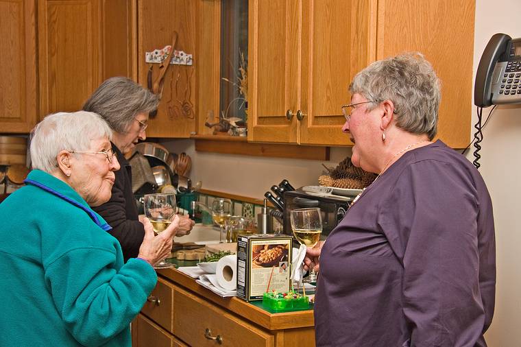 May 16, 2008 - Merrmac, Massachusetts.<br />Paul's birthday and our anniversary celebration.<br />Norma telling a story, Marie, and Joyce listening while continuing to cook.