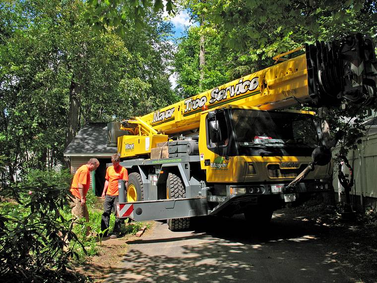 May 23, 2008 - Merrimac, Massachusetts.<br />Removal of tree behind the garage.<br />The crane is being manouvered in place and stabilized.