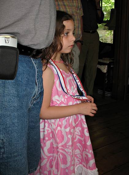 June 7, 2008 - Merrimac, Massachusetts.<br />Carl's and Egils' birthday celebration.<br />Miranda, wearing her fisrt soccer medal, looking at Melody's wedding dress as Joyce describes its intricacies.