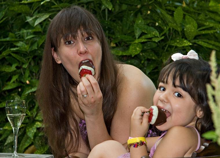 June 21, 2008 - Baltimore, Maryland.<br />Gisela and Luciana enjoying Kirchmayr's chocolate covered strawberries.