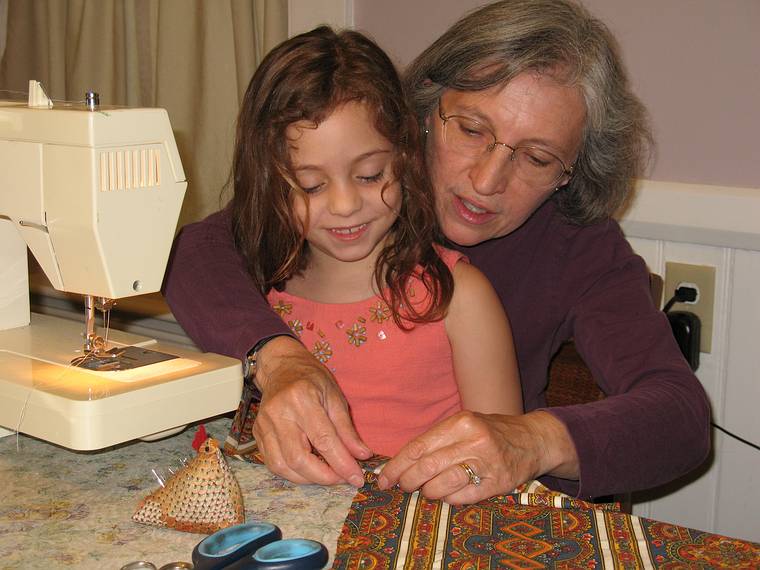 June 29, 2008 - Merrimac, Massachusetts.<br />Miranda and Joyce making an apron for Miranda.<br />Miranda and Joyce pinning in preparation of sewing.