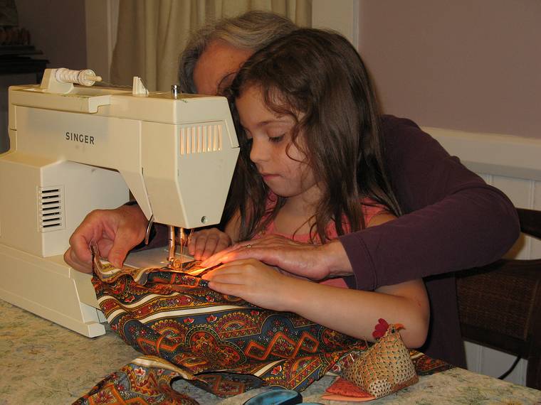 June 29, 2008 - Merrimac, Massachusetts.<br />Miranda and Joyce making an apron for Miranda.<br />Miranda sewing.