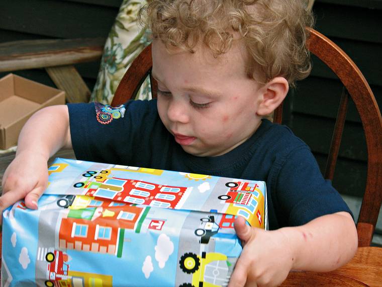 June 29, 2008 - Mendon, Massachusetts.<br />Matthew's 2nd birthday celebration.<br />Matthew meticulously opening one of his presents.