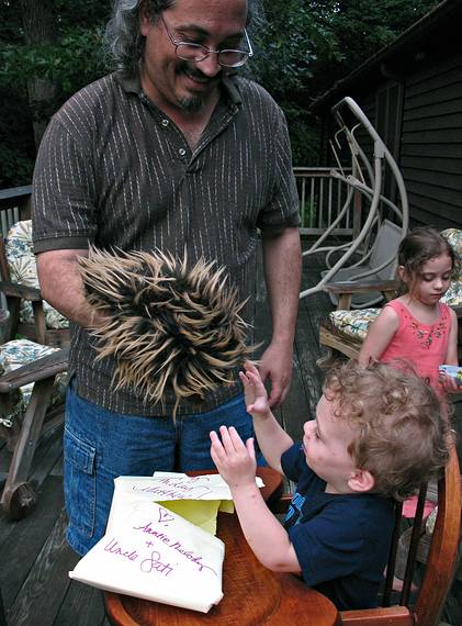 June 29, 2008 - Mendon, Massachusetts.<br />Matthew's 2nd birthday celebration.<br />Carl showing Matthew a porcupine from Aunt Melody and Uncle Sati.