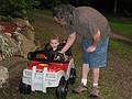 June 29, 2008 - Mendon, Massachusetts.<br />Matthew's 2nd birthday celebration.<br />Matthew in his car, a present from his parents, and Carl helping with the steering.