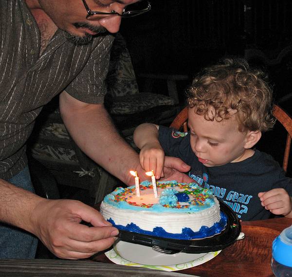 June 29, 2008 - Mendon, Massachusetts.<br />Matthew's 2nd birthday celebration.<br />Carl presenting Matthew with his birthday cake.