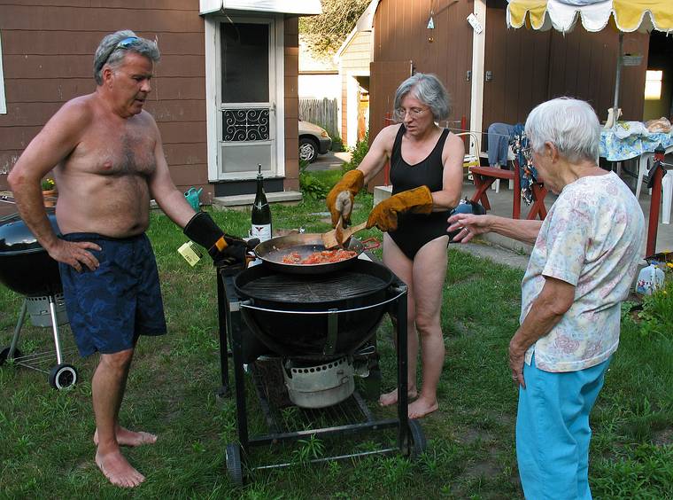 July 13, 2008 - Lawrence, Massachusetts.<br />The making of a Spanish paella (Time-Life: The Cooking of Spain and Portugal).<br />Marie adds her two cents while Jim and Joyce continue with the sofrito.