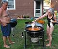 July 13, 2008 - Lawrence, Massachusetts.<br />The making of a Spanish paella (Time-Life: The Cooking of Spain and Portugal).<br />Jim watches Joyce adding rice to the sofrito.