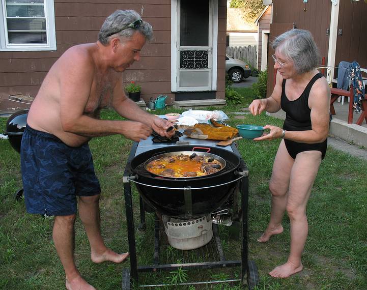 July 13, 2008 - Lawrence, Massachusetts.<br />The making of a Spanish paella (Time-Life: The Cooking of Spain and Portugal).<br />Jim and Joyce adding mussels to the paella.