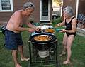 July 13, 2008 - Lawrence, Massachusetts.<br />The making of a Spanish paella (Time-Life: The Cooking of Spain and Portugal).<br />Jim and Joyce adding mussels to the paella.