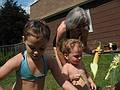 July 17, 2008 - Lawrence, Massachusetts.<br />Miranda, Matthew, and Joyce shucking the corn.