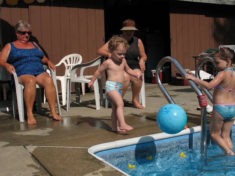 July 17, 2008 - Lawrence, Massachusetts.<br />Norma, Marion, and Miranda watching Matthew kick the ball.