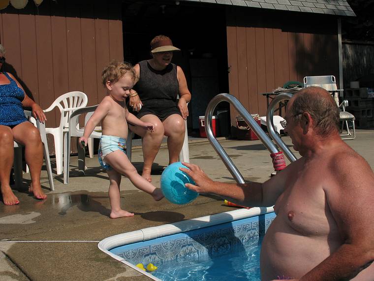 July 17, 2008 - Lawrence, Massachusetts.<br />Marion watching Matthew and Dominic play with the ball.