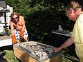 August 23, 2008 - South Hampton, New Hampshire.<br />A pig roast fest at Tom and Kim's.<br />Paul and Dominic replacing the charcoal tray.