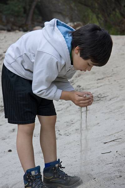Sept. 4, 2008 - Yosemite National Park, California.<br />Gujn playing in the sand at the bottom of dry Mirror Lake.