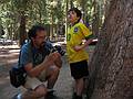 Sept. 4, 2008 - Mariposa Grove, Yosemite National Park, California.<br />Eric checking the photo of Gujn and the tree he just took.