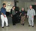 Sept. 27, 2008 - Newburyport, Massachusetts.<br />Annual African Dinner & Dance at the Elks Lodge.<br />Joyce and other dancers (part of a large circle) with a slide show on Kenya in the back.