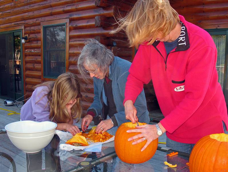 Oct. 11, 2008 - Campton, New Hamshire.<br />At Bill and Carol's log cabin.<br />Aili, Joyce, and Carol carving pumpkins.