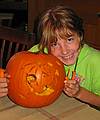 Oct. 11, 2008 - Campton, New Hamshire.<br />At Bill and Carol's log cabin.<br />Aili carving a pumpkin.