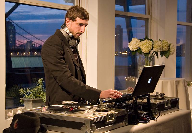 October 18, 2008 - Julian and Gisela's wedding, Brooklyn, New York.<br />Brent tending to the music.