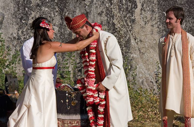 Sept. 6, 2008 - Melody's and Sati's Wedding at Mono Hot Springs, California.<br />Melody placing a garland on Sati with Andre watching.