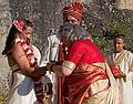 Sept. 6, 2008 - Melody's and Sati's Wedding at Mono Hot Springs, California.<br />Sargam placing white and red bracelets, sign of a married woman, on Melody with Sati and Anoo watching.