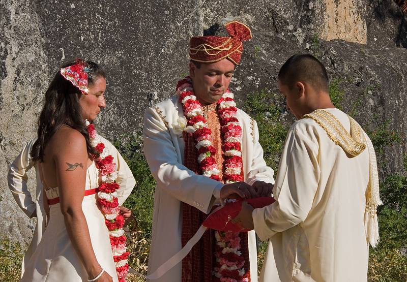 Sept. 6, 2008 - Melody's and Sati's Wedding at Mono Hot Springs, California.<br />Sati taking the mungal sutra from Anoo's pillow to place it around Melody's neck.