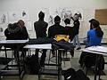 Feb. 25, 2009 - Middlesex Community College, Lowell, Massachusetts.<br />Joyce commenting on her students' drawings of me.