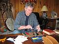 April 5, 2009 - At Bill and Carol's log cabin in Campton, New Hampshire.<br />Chris sharpening one of Carol's kitchen knives.