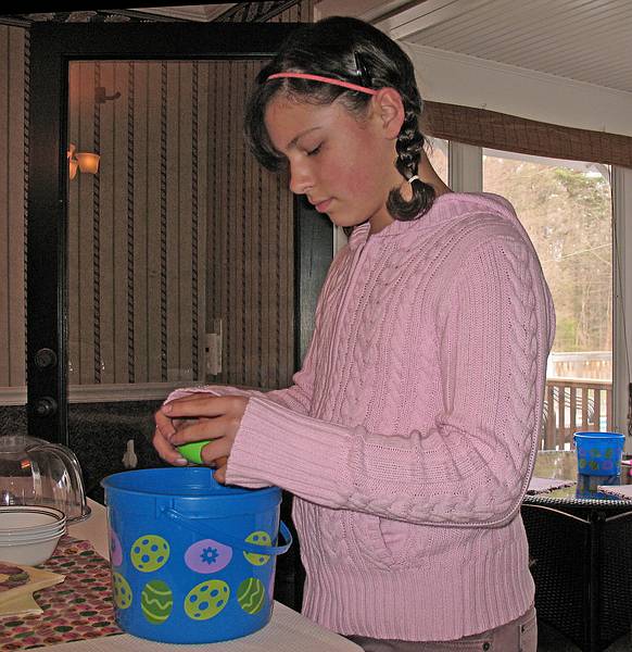 April 12, 2009 - At Tom and Kim's in South Hampton, New Hampshire.<br />Arianna checking the contents of her eggs. Some had candy, some money.